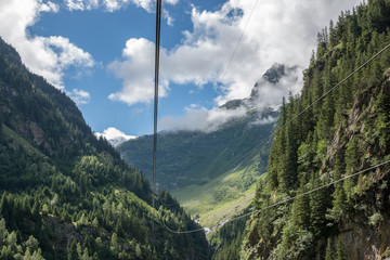 Closeup mountains scenes, cable car to Trift Bridge in national park Switzerland