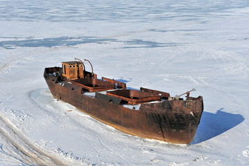 The ship is surrounded by ice on Lake Baikal.