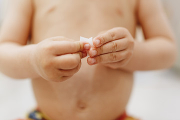 little hands crack and break the dried soap closeup