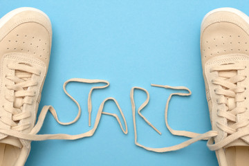 Women sneakers with laces in start text.