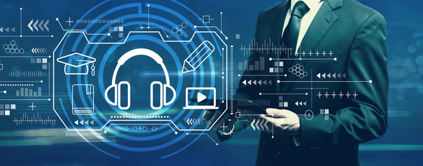 E-learning concept with businessman holding a tablet computer