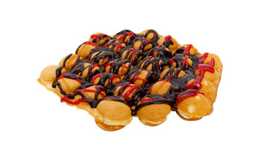 Sweet Hong Kong waffle with chocolate and jam on a white background, close-up