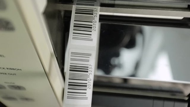 Closeup on barcode enterprise printer when printing barcode labels