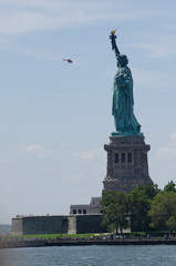 Fototapeta premium Statue of Liberty with helicopter, New York City