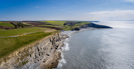 An aerial view of The beach and cliffs at Dunraven bay at Southerndown on the south coast of Wales