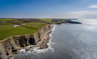 Fototapeta na wymiar An aerial view of The beach and cliffs at Dunraven bay at Southerndown on the south coast of Wales
