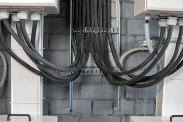 black cables are connected to the switchboard