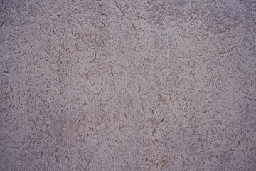 Dry cracking mud wall texture, natural background concept