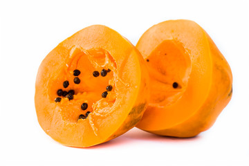 Raw organic cut papaya isolated on white.