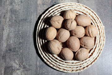 A lot of walnuts lying on the table