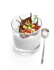 Homemade yogurt with grilled figs and pistachio isolated on white