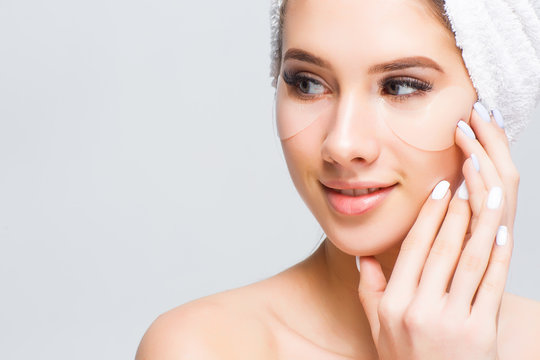 Portarait of perfect natural skin , young model with towel on hean have a cosmetics treatments!