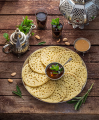Moroccan pancakes Baghrir or crepes with 1000 holes served with honey and mint tea