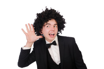 Young man wearing afro wig