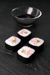 sushi on black stone