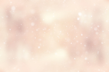 blurred snow / winter abstract background, snowflakes on abstract blurred glowing leaf background