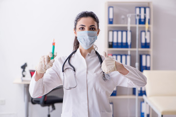 Young female doctor in infusion concept 