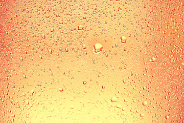 yellow tinted glass drops / abstract background texture