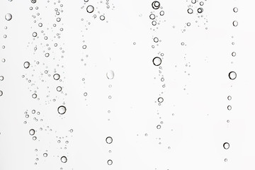 Naklejka na ściany i meble white isolated background water drops on the glass / wet window glass with splashes and drops of water and lime, texture autumn background