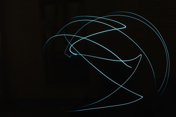 abstract pattern of light on a black background.