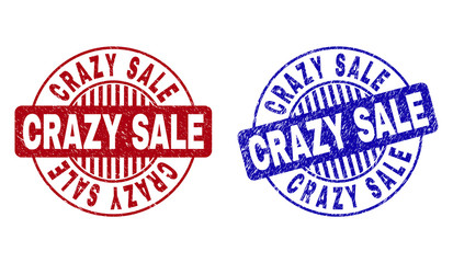 Grunge CRAZY SALE round stamp seals isolated on a white background. Round seals with grunge texture in red and blue colors. Vector rubber imitation of CRAZY SALE tag inside circle form with stripes.