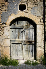 Old ancient house door in an Italian country