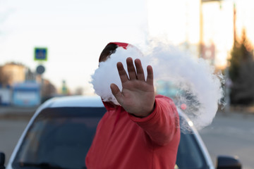A man in the city warns passers-by from electronic cigarettes.