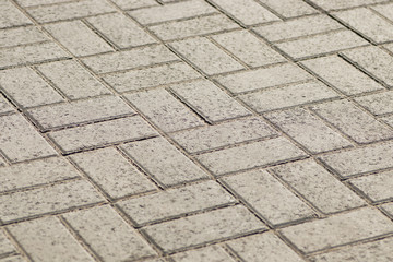 Abstract background - gray paving slabs in the form of squares.