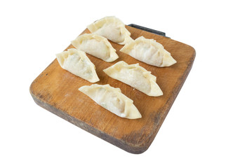 raw dumplings or gyoza isolated on white background