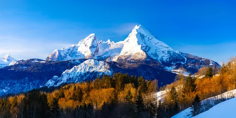 Washable wall murals Mont Blanc Beautiful winter wonderland mountain scenery in the Alps with pilgrimage church of Maria Gern and famous Watzmann summit in the background, Berchtesgadener, Bavaria, Germany