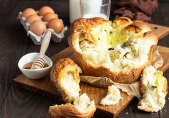 Freshly brioche bread with cottage cheese and raisin filling. Traditional Romanian sweet yeast bread. Easter bread. Rustic style. 