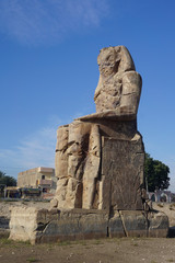 Luxor, Egypt: One of the Colossi of Memnon (1350 BC), two massive statues of the Pharaoh Amenhotep III, who reigned during the 13th Dynasty.