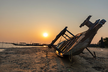 old fishing boat at sunset