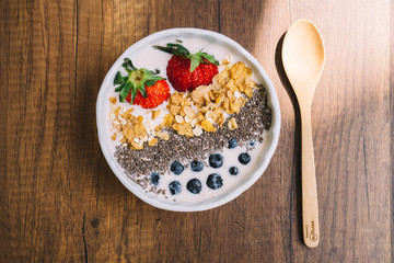 Yogurt with strawberry, blueberry, chia seed and cornflake