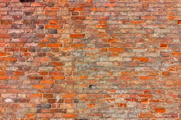 Texture of an old red brick wall.