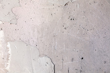 Texture background. Gray concrete wall with rough seams, mortar, plaster, abrasions, irregularities. Concept construction of country house, cottage, garage