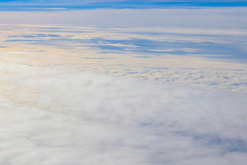 Fototapeta na wymiar Beautiful white clouds in blue sky. View from airplane