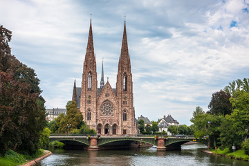 Fototapeta na wymiar View on the St. Paul Church from the Ill river in Strasbourg, France
