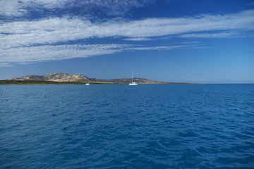 Naklejka premium view of the sea and mountains in Stintino Sardinia italy