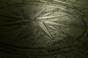 Compass Rose on a pavement in Castro (Italy) at night. Landscape format.