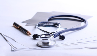 stethoscope,x-ray and pen on the table. photo with copy space