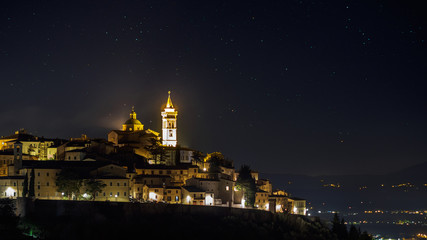 Fototapeta na wymiar Night view of the town of Trevi in Umbria (Italy). Landscape format.