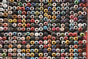 empty spray cans, colorful
