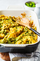 Broccoli, green peas and cauliflower cheese casserole in the oven dish.