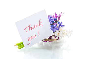 spring beautiful flowers of a hyacinth with a thank you card