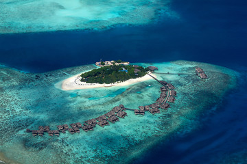 aerial view of tropical paradise maldives island resort with coral reef turquoise blue ocean tourism background - obrazy, fototapety, plakaty