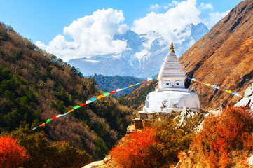 Buddhist stupa in autumn Himalaya mountains. Khumbu valley, Everest region, Nepal - obrazy, fototapety, plakaty