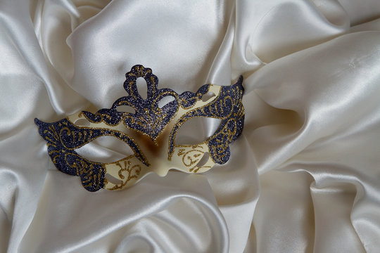 Venetian carnival mask. Half face design Blue and golden  carnival mask  on white with clipping path