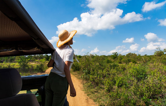 Woman Enjoying View From The Safari Truck