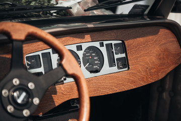 Luxury elegan wedding retro car. Vintage wedding car. Classic italian car. Retro car, vintage steering wheel clock, wooden,